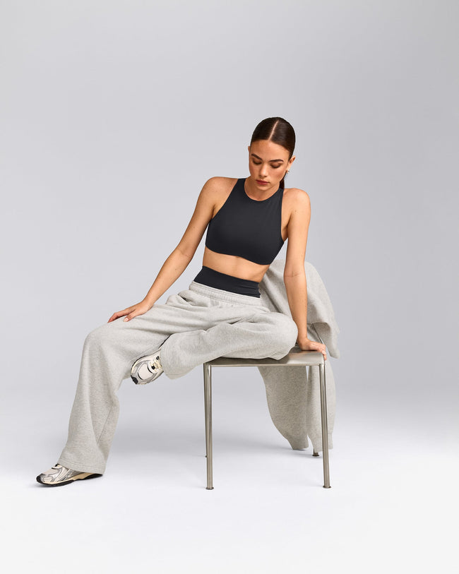 SoftMotion™ High Neck Sports Bra with Grey Logo | Coal