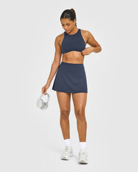 SoftMotion™ High Neck Sports Bra with White Logo | True Blue