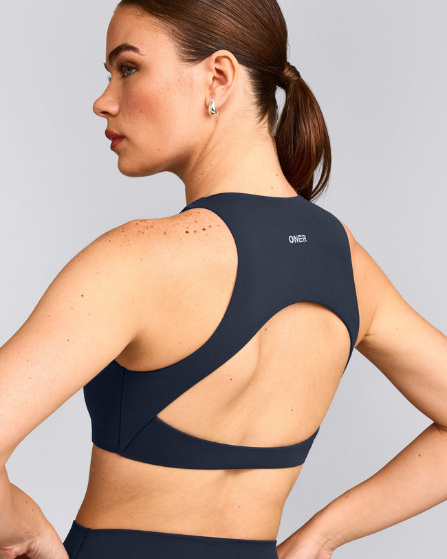 SoftMotion™ High Neck Sports Bra with Grey Logo | True Blue