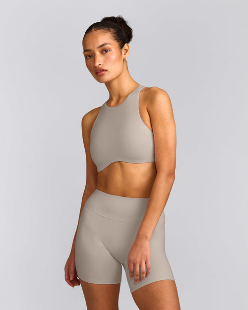 SoftMotion™ High Neck Sports Bra with White Logo | Warm Sand