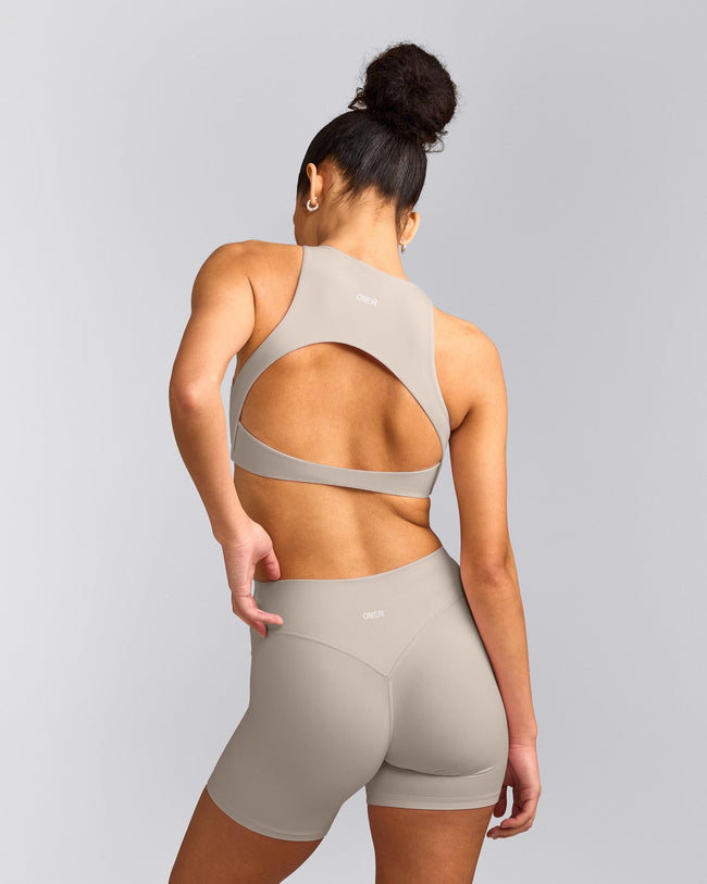 SoftMotion™ High Neck Sports Bra with White Logo | Warm Sand