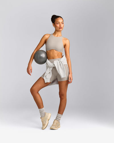 SoftMotion™ High Neck Sports Bra with White Logo | Warm Sand