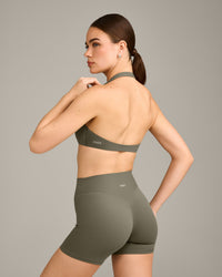 SoftMotion™ Minimal Halter Neck Bralette with Grey Logo | Alpine Green