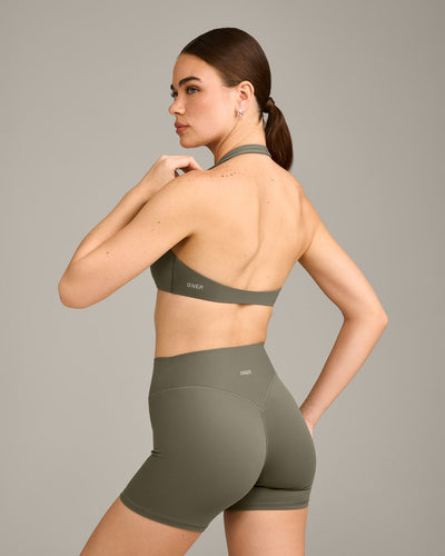 SoftMotion™ Minimal Halter Neck Bralette with Grey Logo | Alpine Green