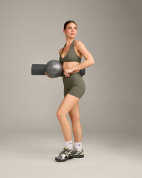 SoftMotion™ Minimal Halter Neck Bralette with Grey Logo | Alpine Green