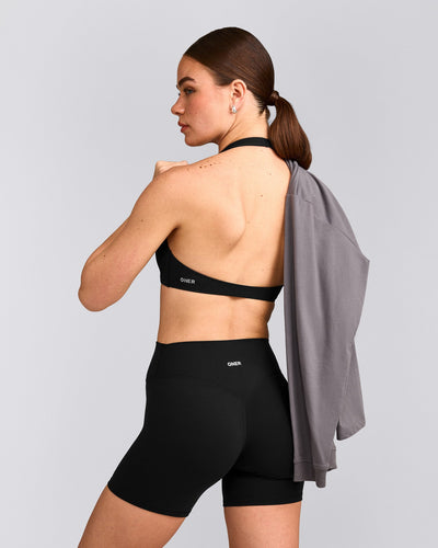 SoftMotion™ Minimal Halter Neck Bralette with Gray Logo | Black
