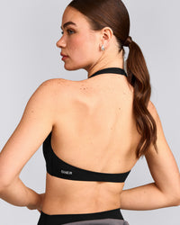 SoftMotion™ Minimal Halter Neck Bralette with Gray Logo | Black