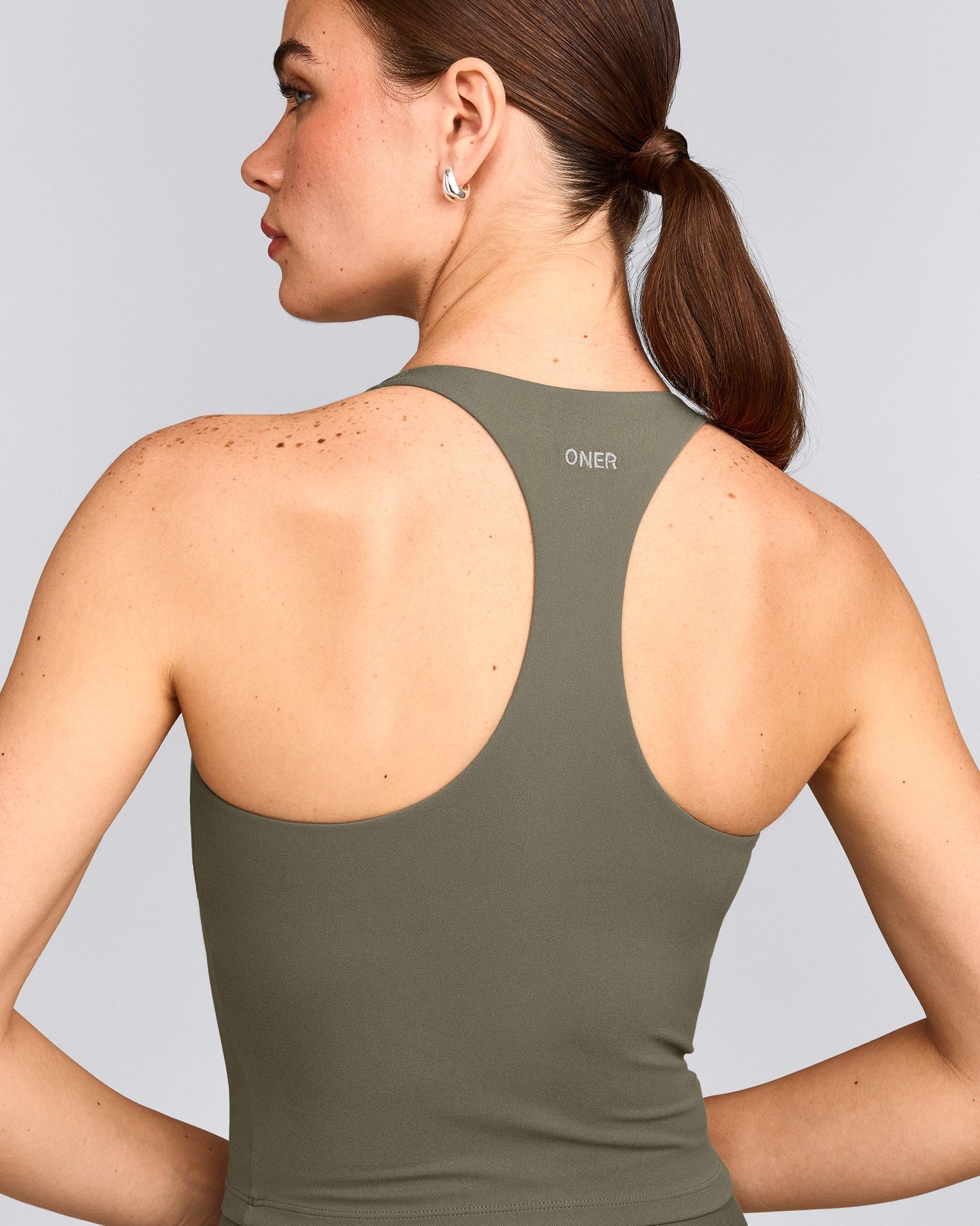 SoftMotion™ Racer Back Mid Tank Top with Built in Bra Shelf with Gray Logo | Alpine Green