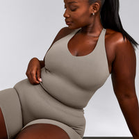 SoftMotion™ Racer Back Mid Tank Top with Built in Bra Shelf with White Logo | Warm Sand