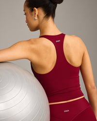 SoftMotion™ Racer Back Mid Vest with Built in Bra Shelf with Grey Logo | Ruby Red