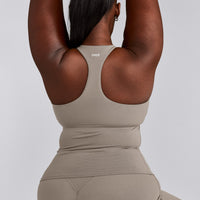 SoftMotion™ Racer Back Tank Top with Built in Bra Shelf with White Logo | Warm Sand
