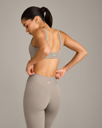 SoftMotion™ Scoop Back Bralette with White Logo | Warm Sand