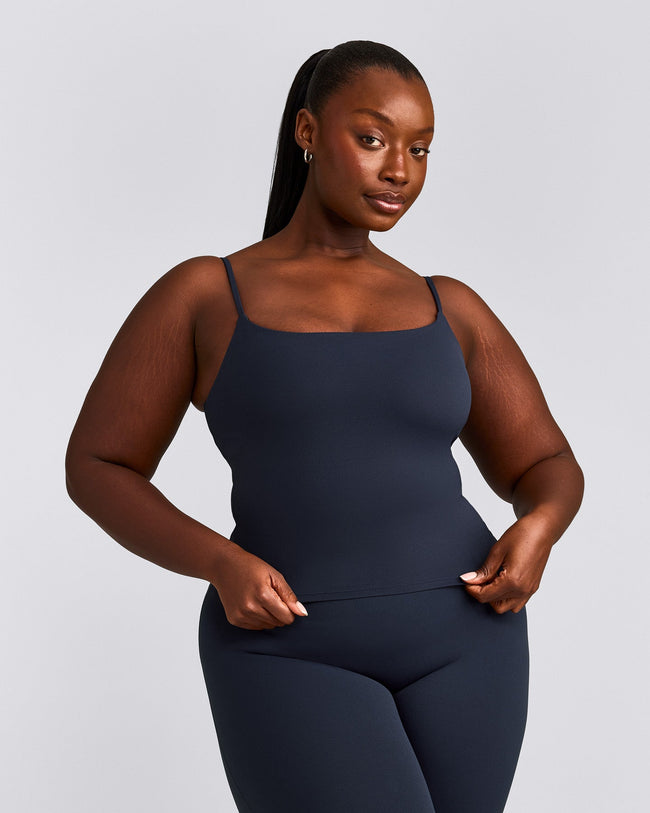 SoftMotion™ Strappy Mid Vest with Built in Bra Shelf with Grey Logo | True Blue