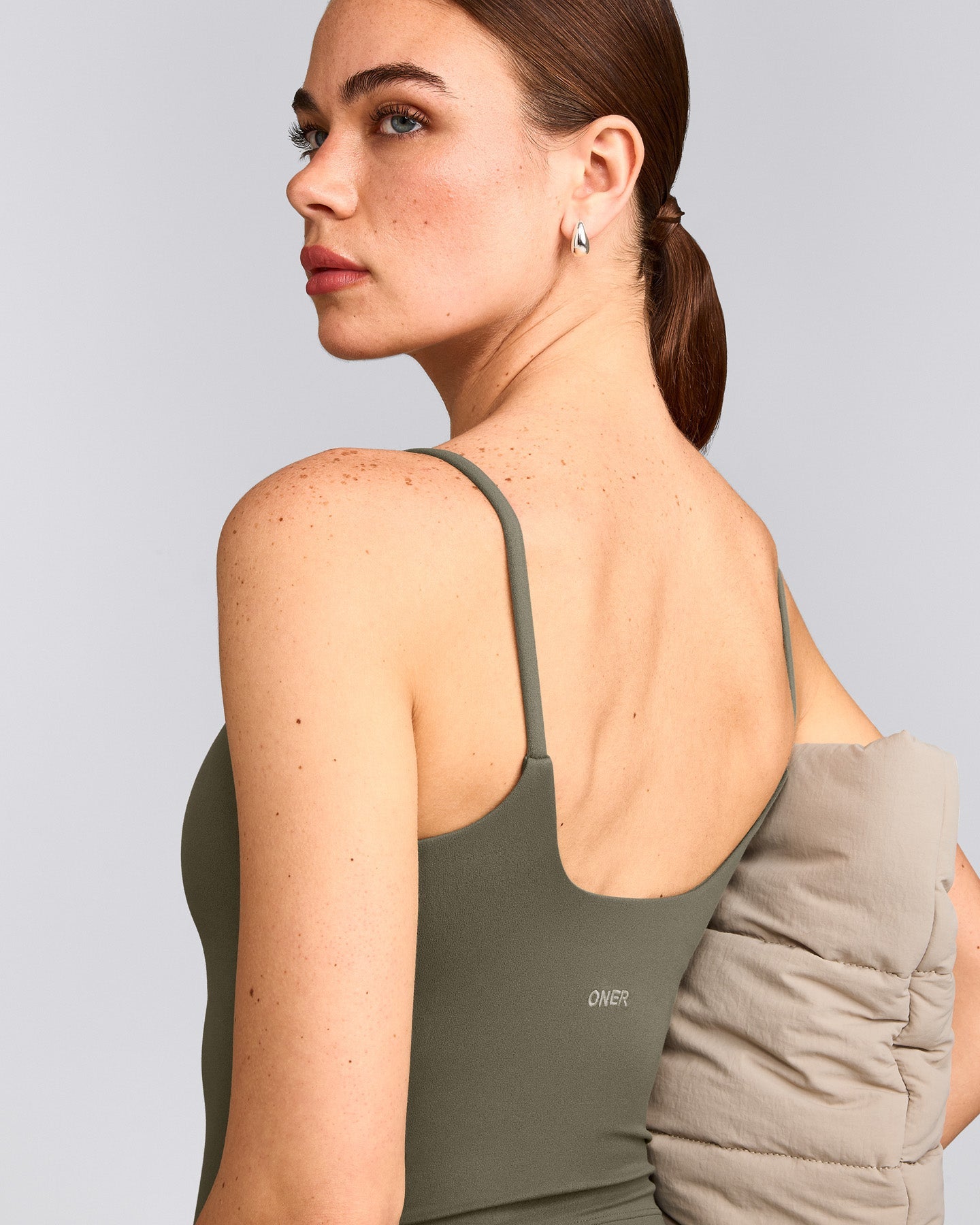 SoftMotion™ Strappy Mid Vest with Built in Bra Shelf with Grey Logo | Alpine Green