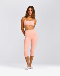 SoftMotion™ High Waisted Capri Leggings with Grey Logo | Peach Orange