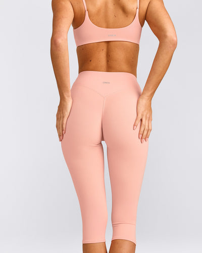 SoftMotion™ High Waisted Capri Leggings with Grey Logo | Peach Orange