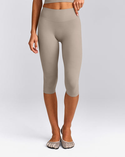 SoftMotion™ High Waisted Capri Leggings with White Logo | Warm Sand