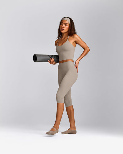 SoftMotion™ High Waisted Capri Leggings with White Logo | Warm Sand