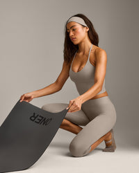 SoftMotion™ High Waisted Capri Leggings with White Logo | Warm Sand
