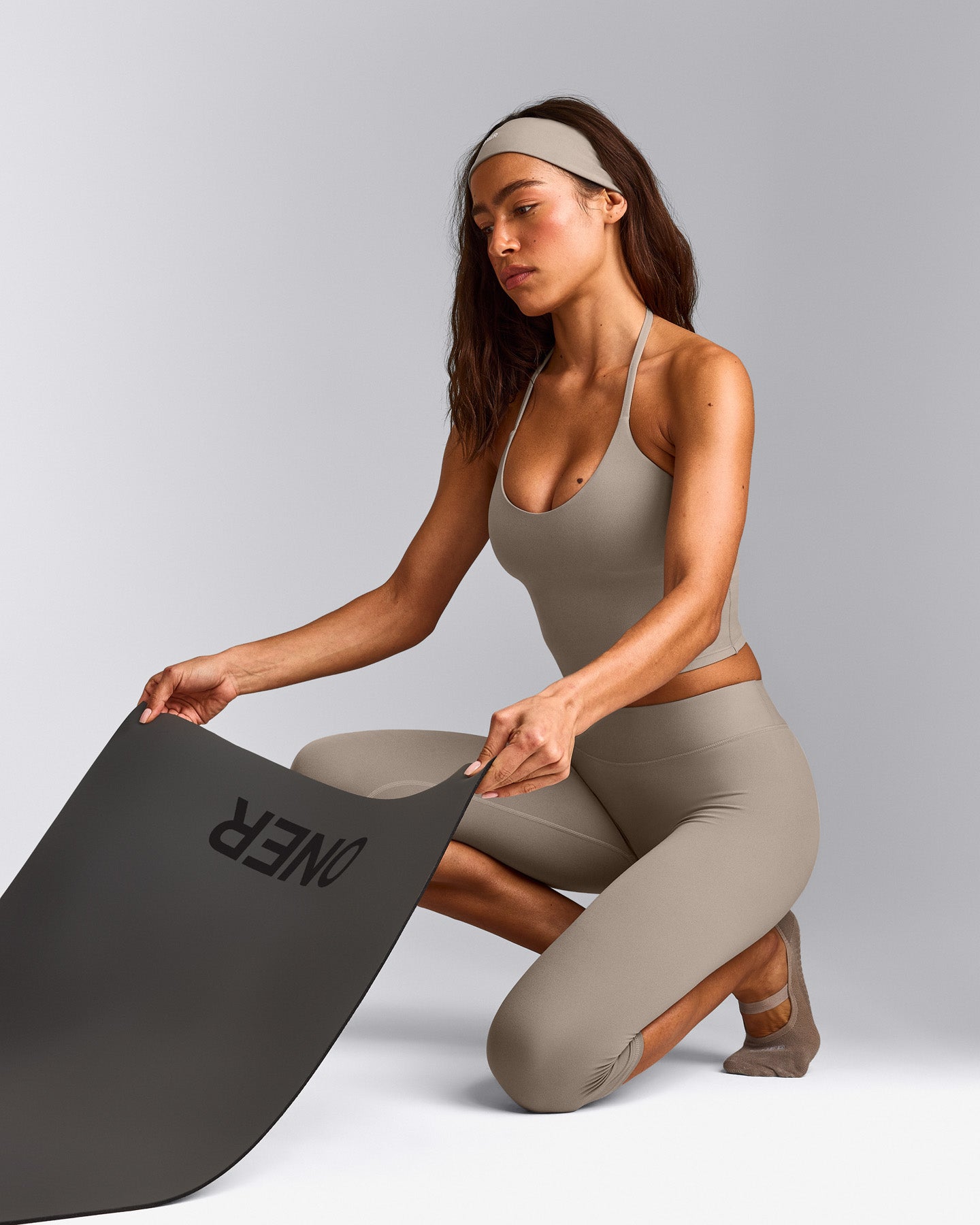 SoftMotion™ High Waisted Capri Leggings with White Logo | Warm Sand