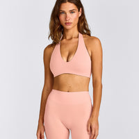 SoftMotion™ Minimal Halter Neck Bralette with Grey Logo | Peach Orange