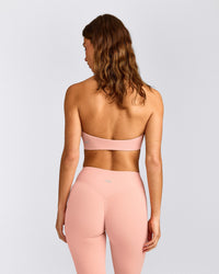SoftMotion™ Minimal Halter Neck Bralette with Grey Logo | Peach Orange