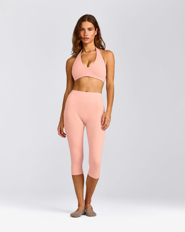 SoftMotion™ Minimal Halter Neck Bralette with Grey Logo | Peach Orange