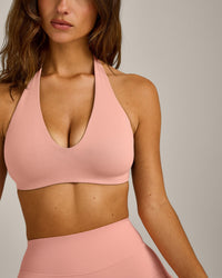 SoftMotion™ Minimal Halter Neck Bralette with Grey Logo | Peach Orange