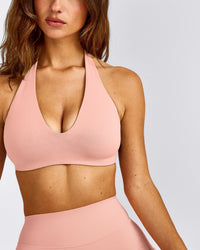 SoftMotion™ Minimal Halter Neck Bralette with Grey Logo | Peach Orange