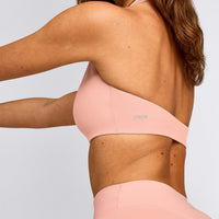 SoftMotion™ Minimal Halter Neck Bralette with Grey Logo | Peach Orange