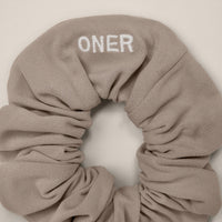 SoftMotion™ Scrunchie with White Logo | Warm Sand