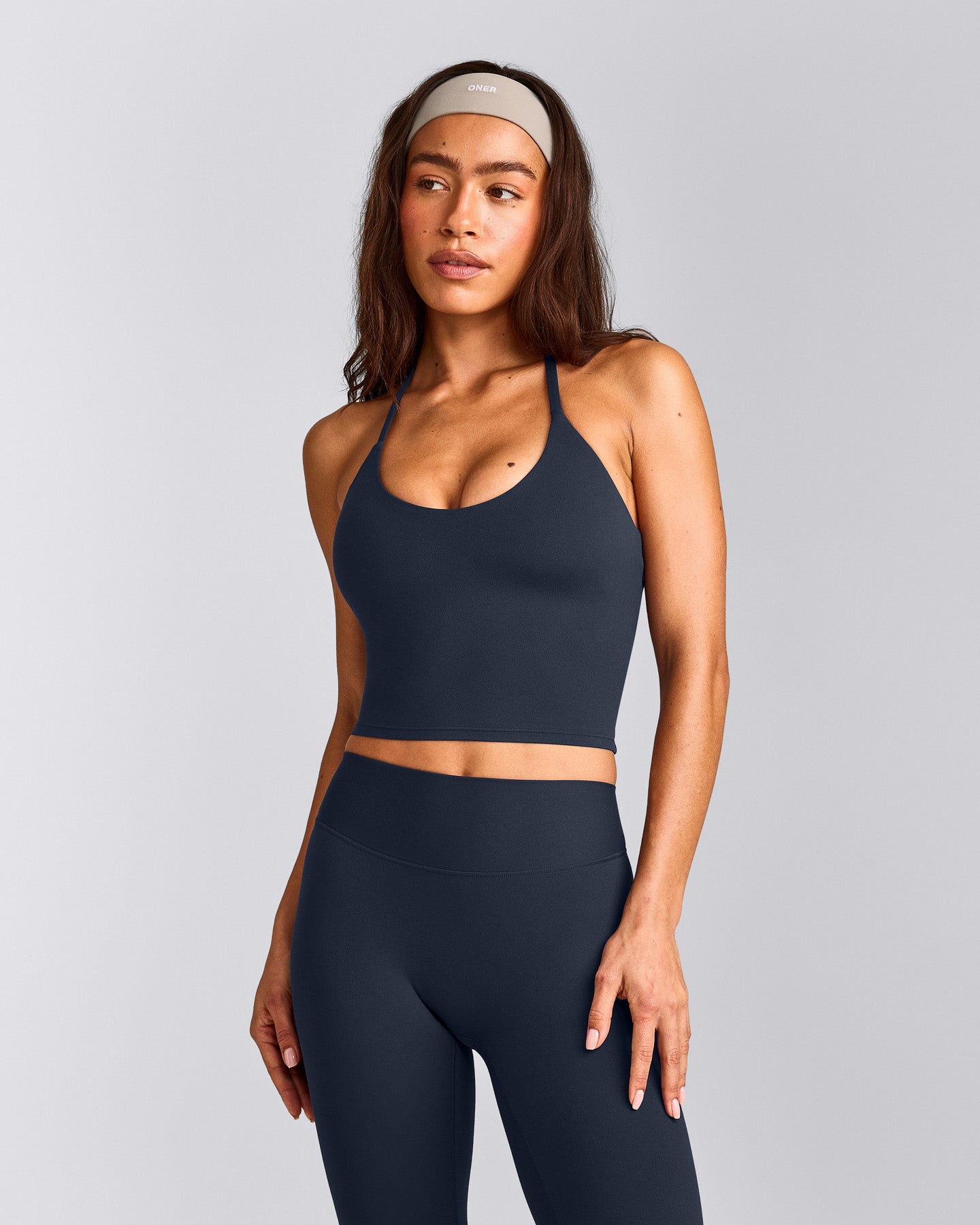 SoftMotion™ Strappy Halter Neck Mid Vest with Built in Bra Shelf with Grey Logo | True Blue