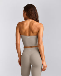 SoftMotion™ Strappy Halter Neck Mid Vest with Built in Bra Shelf with White Logo | Warm Sand