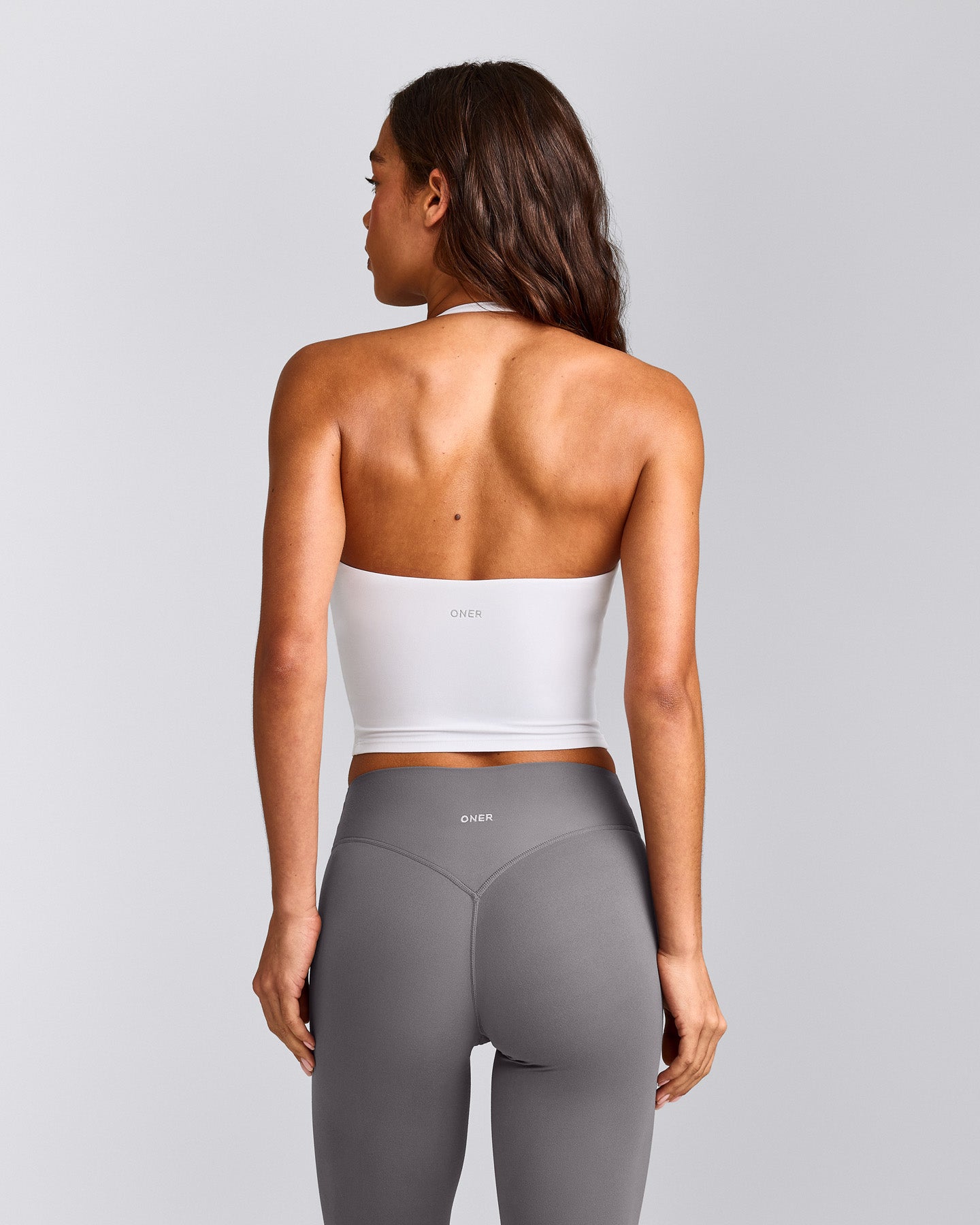 SoftMotion™ Strappy Halter Neck Mid Vest with Built in Bra Shelf with Grey Logo | White