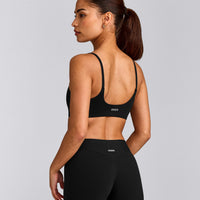 SoftMotion™ Strappy Sports Bra with Grey Logo | Black