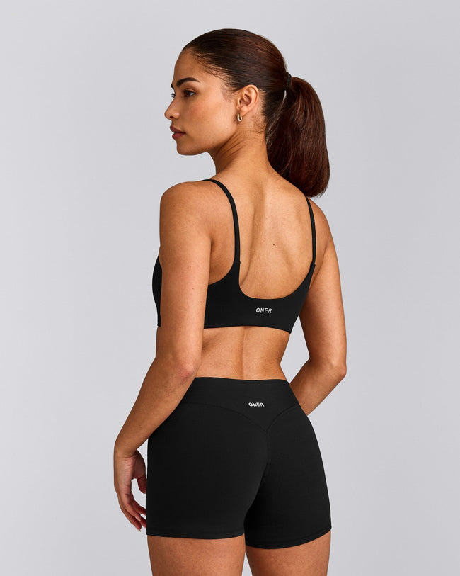 SoftMotion™ Strappy Sports Bra with Grey Logo | Black