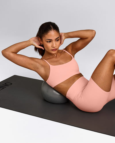 SoftMotion™ Strappy Sports Bra with Grey Logo | Peach Orange