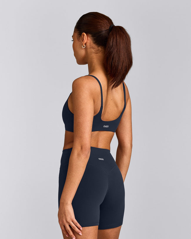 SoftMotion™ Strappy Sports Bra with Grey Logo | True Blue