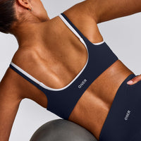 SoftMotion™ Strappy Sports Bra with Grey Logo | True Blue