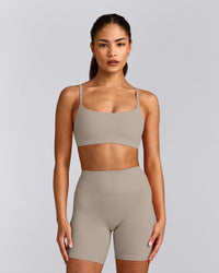 SoftMotion™ Strappy Sports Bra with White Logo | Warm Sand