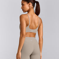 SoftMotion™ Strappy Sports Bra with White Logo | Warm Sand