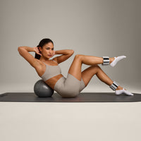 SoftMotion™ Strappy Sports Bra with White Logo | Warm Sand