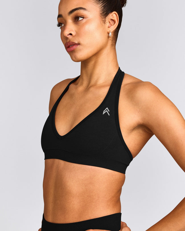 EffortlessLift™ Seamless Halter Neck Sports Bra with Grey Logo | Black