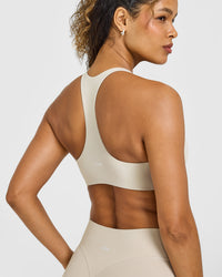 SoftMotion™ Bralette with White Logo | Sand