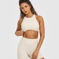 SoftMotion™ High Neck Sports Bra with White Logo | Sand