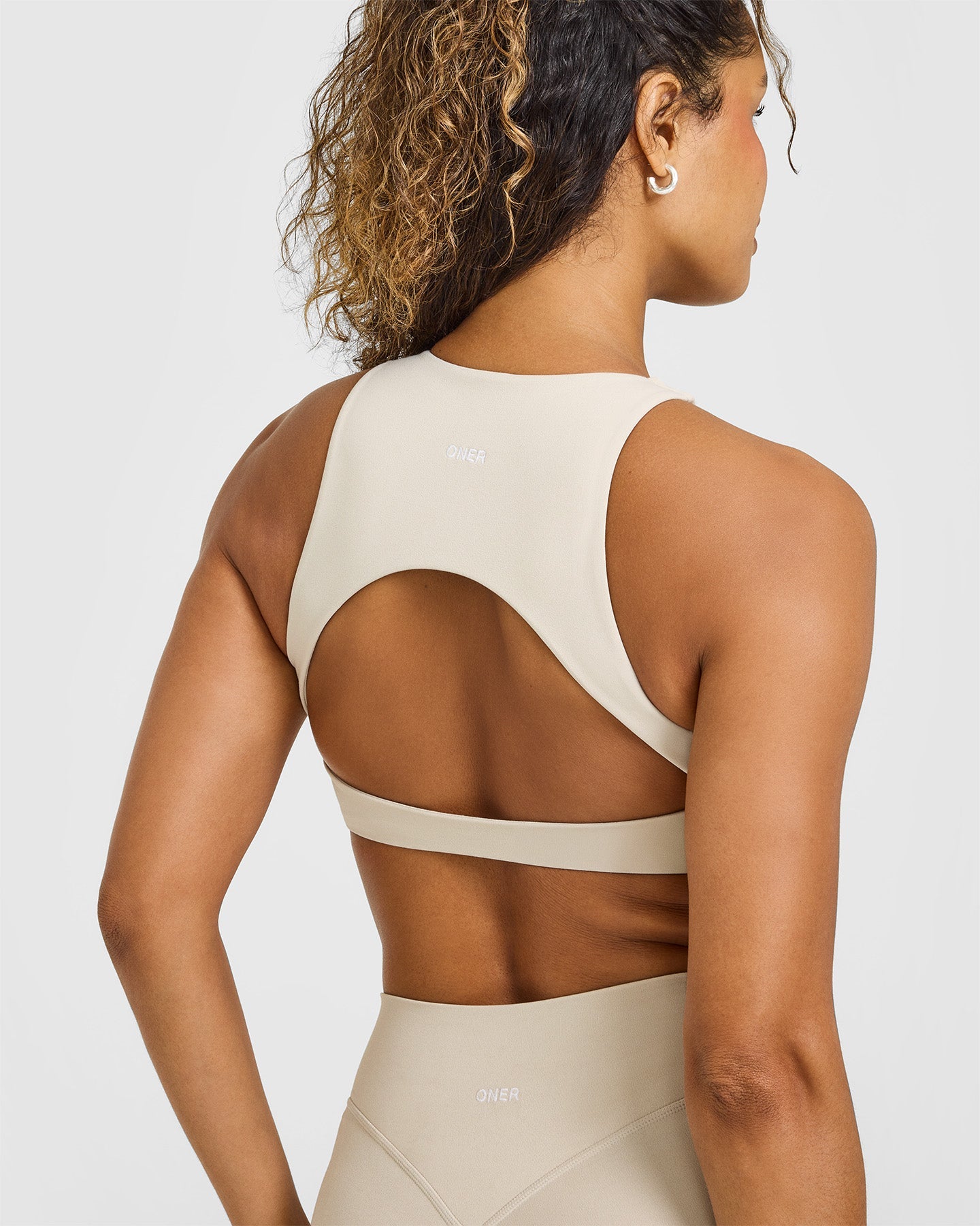 SoftMotion™ High Neck Sports Bra with White Logo | Sand