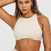SoftMotion™ High Neck Sports Bra with White Logo | Sand