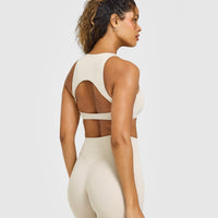 SoftMotion™ High Neck Sports Bra with White Logo | Sand