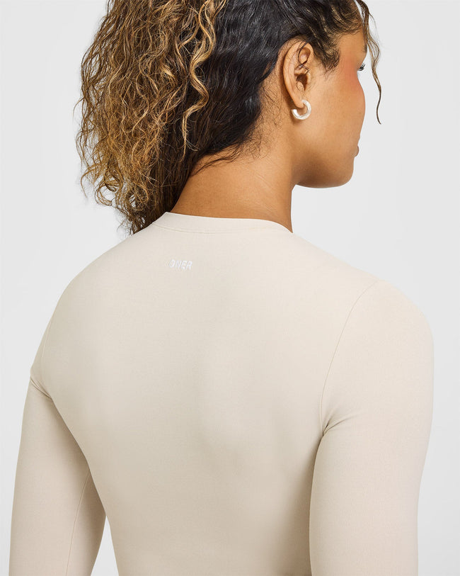 SoftMotion™ Long Sleeve Mid Top with White Logo | Sand