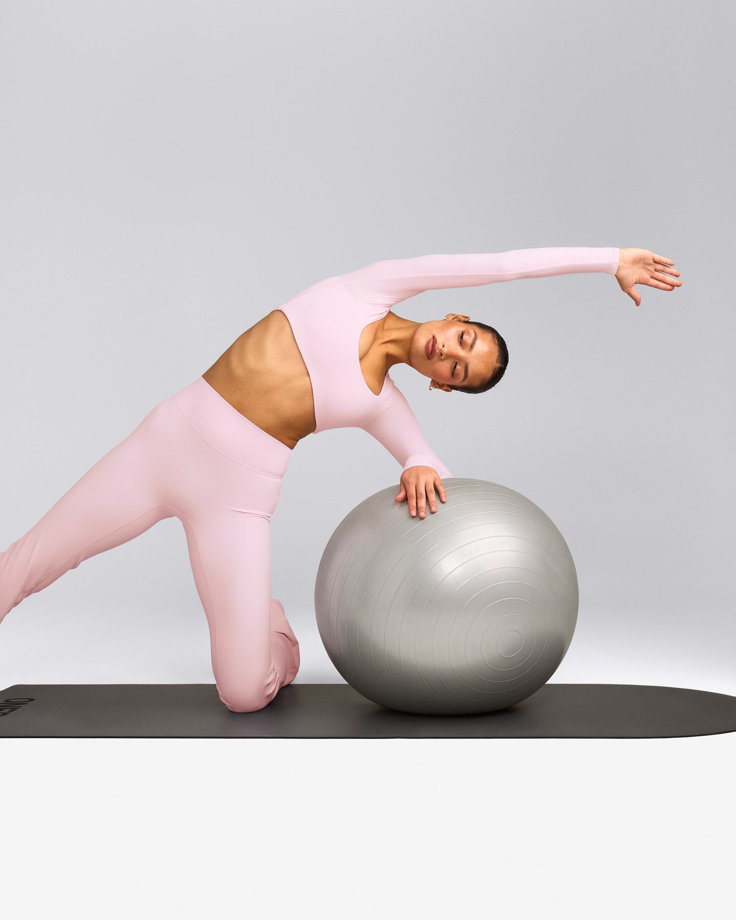 SoftMotion™ Scoop Neck Long Sleeve Crop Top with Built in Bra Shelf with Grey Logo | Soft Girl Pink
